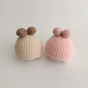 Stylish knitted winter baby hats with 3D bows in cream and pink for girls