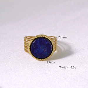 Macro detail of gold multi-layer ring with blue gemstone and dimension measurements
