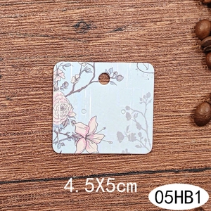 Macro detail of blue floral jewelry display card for earrings sized 4.5x5cm