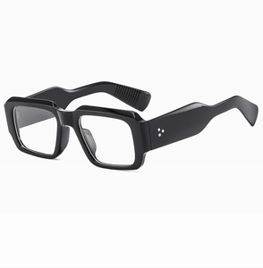 Detailed side view of black square sunglasses with three star metal studs on thick temples