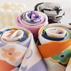 Elegant geometric floral silk-like neckerchief with various colorful printed patterns