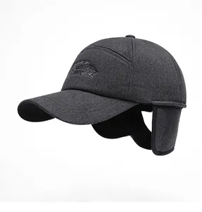 Detail showing the inner fleece lining and foldable ear flaps of a winter baseball cap