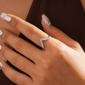 Close-up of a silver V-shaped chevron ring with sparkling pavé cubic zirconia