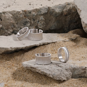 Minimalist S925 sterling silver frosted rings with matte texture on industrial stone