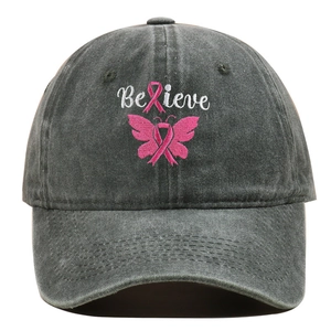 Detail of embroidered pink ribbon and butterfly on washed charcoal denim baseball cap