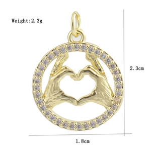 Detail view of heart hand gesture pendant with cubic zirconia and size dimensions