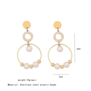 Detailed view of gold stainless steel heart earrings with pearls and size measurements
