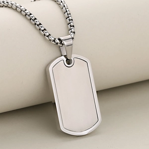 Minimalist silver rectangle dog tag pendant necklace with ball chain on beige background