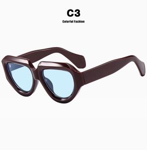 Retro irregular thick frame sunglasses with light blue lenses for fashion posing
