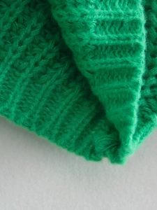 Dettaglio in maglia spessa verde brillante con trama di lana di alta qualità