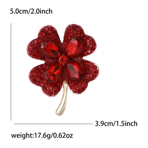 Detailed view of red rhinestone clover brooch with dimensions 5.0cm and weight 17.6g