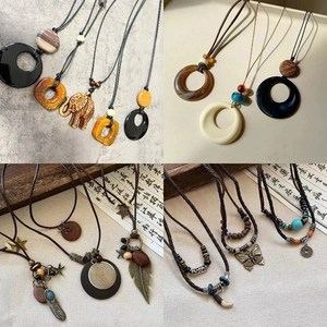 Detail of vintage ethnic pendant necklaces with resin beads and engraved charms