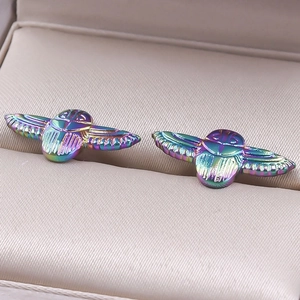Macro shot of 304 stainless steel beetle earrings with iridescent rainbow plating finish