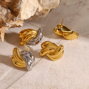 Polished stainless steel twisted knot earrings in gold and silver on stone base