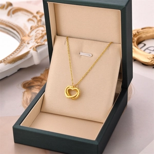 Golden double heart pendant necklace for women with elegant cross chain in a jewelry box