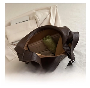 Interior view showing large capacity and lychee texture of the dark brown tote bag