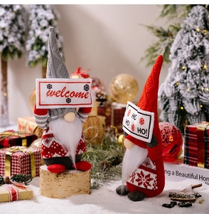 Detailed view of Christmas gnomes with welcome signs in a festive holiday scene