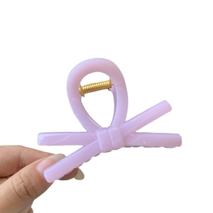 Light purple bow hair claw clip made of glossy resin for Y2K style hairstyles