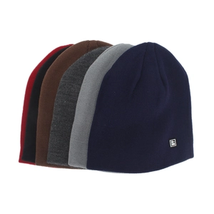 Set of winter knit beanies in various colors with small leather label for men and women