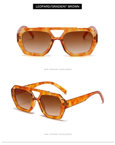 Detail of leopard print sunglasses featuring double bridge and gradient brown lenses