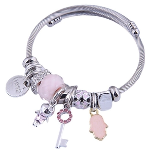 Charmed silver cable bracelet with pink faceted beads and various metal pendants