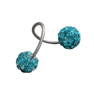 Close-up of silver twister barbell earring with blue pavé crystal balls detail