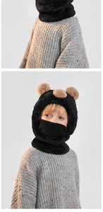 Detail of kids plush bear hat showing the thick faux fur texture and integrated knit mask