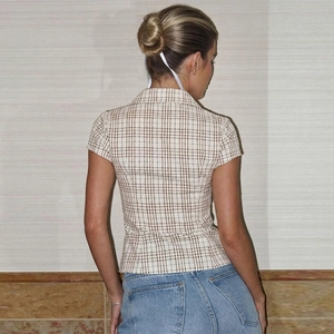 Rear view of women's vintage plaid shirt with slim fit cut and beige checkered pattern