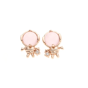 Macro view of rose gold astronaut stud earrings with pink gemstones and zircon accents