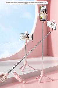 Pink selfie stick showing folded size and three extended heights with tripod stand