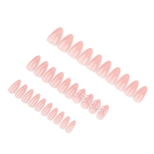 Faux ongles rose nude en amande avec nœuds 3D en cristal et finition brillante
