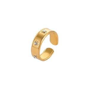 Close-up of gold-plated stainless steel ring with three inlaid sparkling crystals