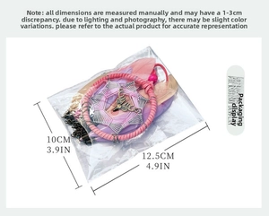 Detailed view of handmade pink dreamcatcher with feathers and a deer head charm pendant