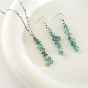 Natural agate stone jewelry set with silver necklace and beaded earrings in white plate