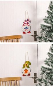 Detail of wooden gnome ornaments with American flag and sunflower autumn harvest patterns