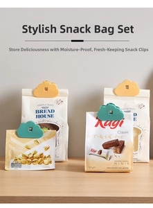Detail showing cloud-shaped moisture-proof clips sealing snack bags on a wooden table