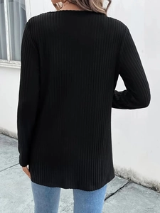 Rear view of black long-sleeved ribbed knit cardigan featuring vertical texture detail