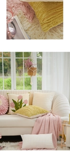 Close-up of pink tulip flower embroidery and textured pleats on a Nordic style pillow