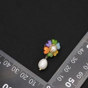 Floral natural pearl drop earrings with colorful zircon petals on black background