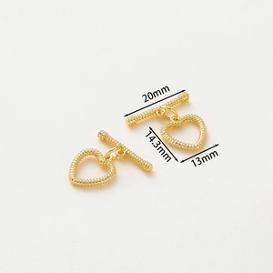Detailed view of gold plated heart shaped OT toggle clasp with 20mm bar dimensions