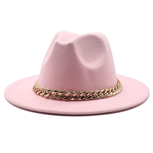 Pink wide brim fedora jazz hat with a thick gold chain decoration on white background