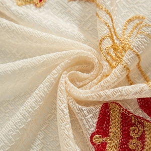 Christmas lace curtain with bell embroidery and gold scroll patterns on cream fabric