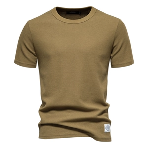 Detailed view of khaki waffle knit fabric texture and premium crew neck t-shirt design
