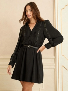 French style V-neck A-line mini dress in black with long sleeves and gold stud details