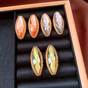 Detail view of marquise-cut crystal earrings in three colors on black velvet jewelry tray