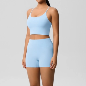 Close-up of light blue seamless yoga set showing high-waisted shorts and crop top texture