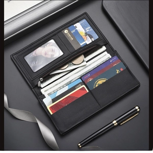 Detail of black leather long wallet showing multi-card slots and zippered coin pocket