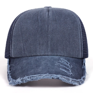 Distressed navy blue washed denim trucker hat with mesh back and vintage torn brim details