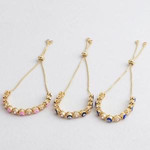 Detailed view of adjustable evil eye bracelets in pink, black and blue with zircon stones