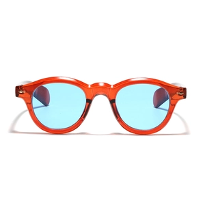 Retro round sunglasses with transparent amber frames and light blue lenses for a vintage look